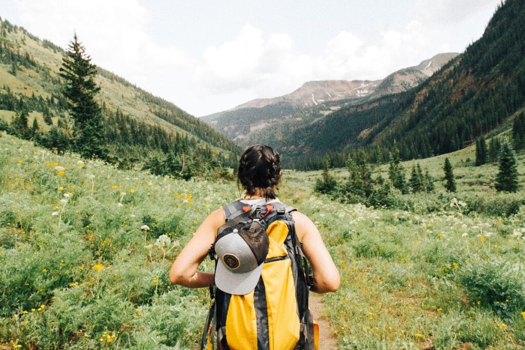 Digital nomad hiking in the countryside