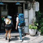 backpackers entering a hostel